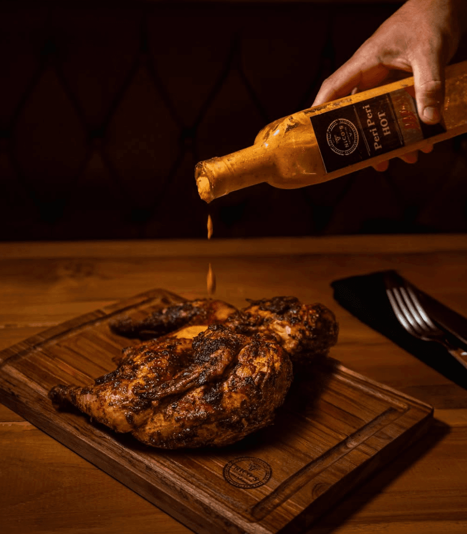 Flame-grilled peri peri chicken at Nico's Smokehouse Canggu